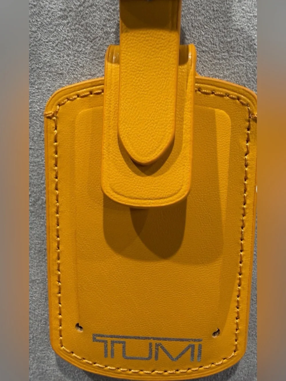 NEW IN BOX - Tumi 3.625” x 2.25” Leather Luggage Name Tag w/ Buckle - ORANGE